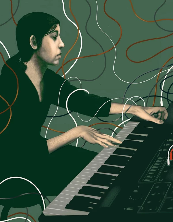 Portrait of musician Suzanne Ciani at a keyboard, surrounded by cables